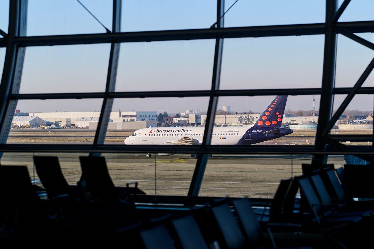 Brussels strike flight disruption illustrated by aircraft and airport facilities in Belgium.