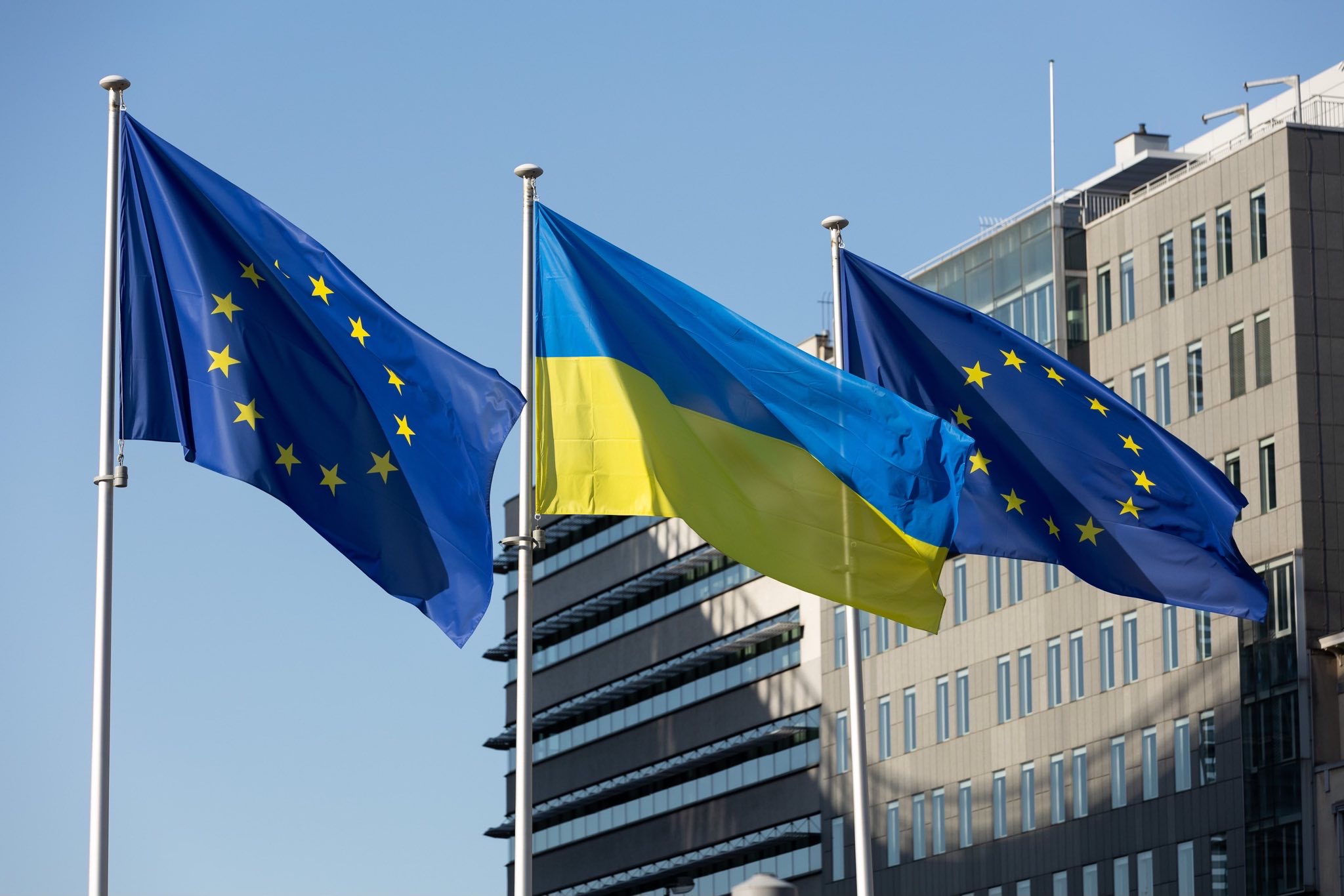 EU Commission building displaying Ukraine flags in Brussels