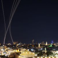 Security teams investigate impact site during Iran Israel conflict escalation