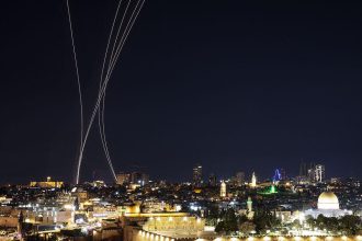Security teams investigate impact site during Iran Israel conflict escalation