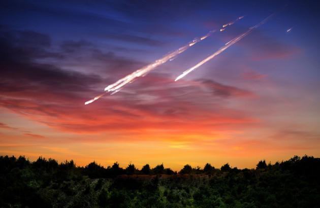 Meteor explosion report featuring a glowing fireball streaking through the night sky