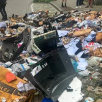 Firefighters Quickly Extinguish Garbage Truck Blaze Near Leuven Courthouse Preventing Further Damage