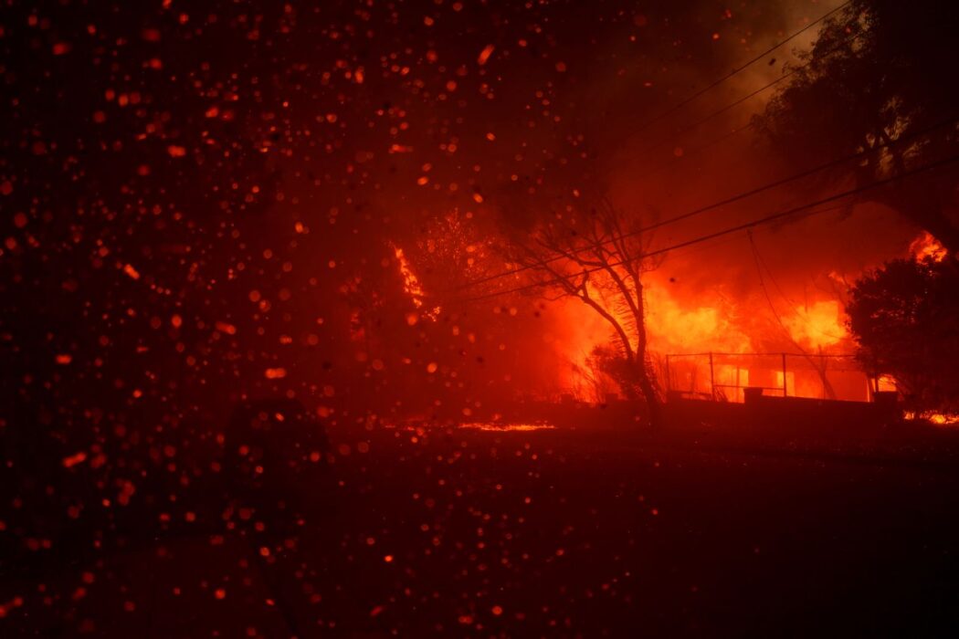 Flames from the Palisades Fire burn homes