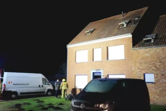 Geel house fire father rescues family of 5 through window