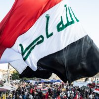 PMF forces Iraq Baghdad skyline showing rising security tensions 2026