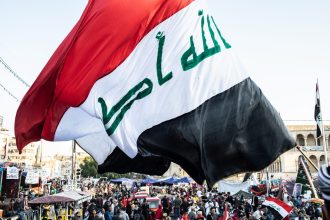 PMF forces Iraq Baghdad skyline showing rising security tensions 2026