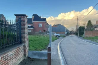 Haaltert resident's fence blocks sidewalk causes Debate