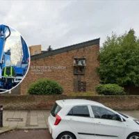 Holsbeek Pastor blesses restored weather vane at Rotselaar church