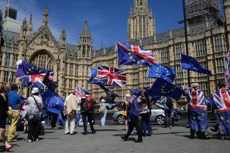 Britain EU membership debate highlighted by EU flags during a Brexit protest in Parliament Square, London