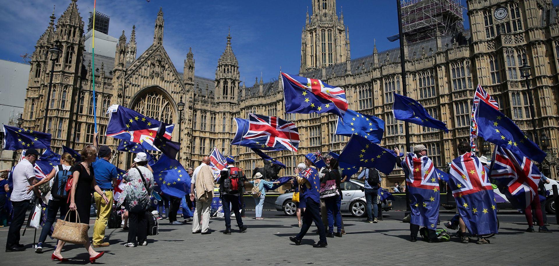 Britain EU membership debate highlighted by EU flags during a Brexit protest in Parliament Square, London