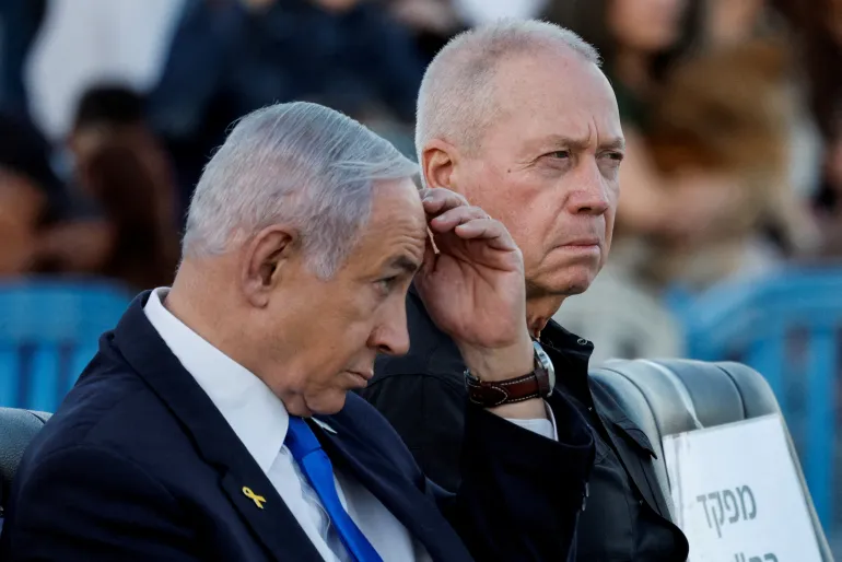 Israeli Prime Minister Benjamin Netanyahu and former Israeli Defence Minister Yoav Gallant