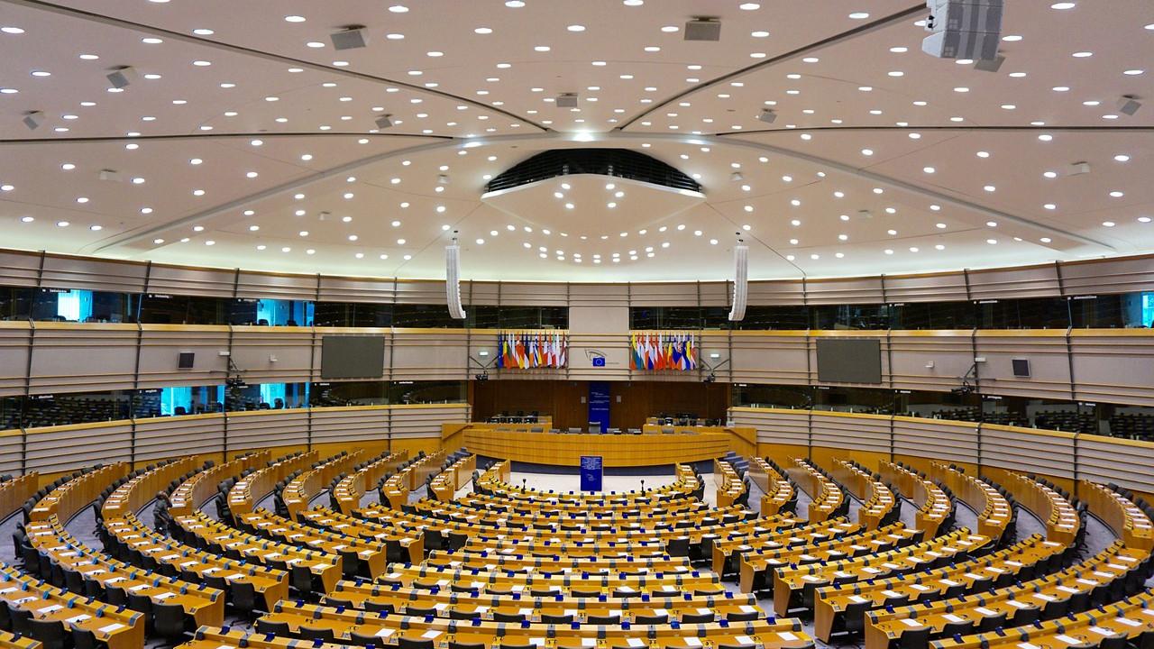 European elections and EU policy changes represented by the European Parliament chamber in Brussels.