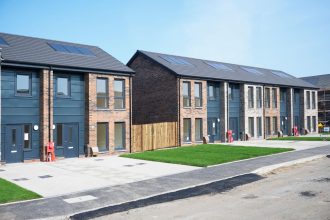 New home prices UK highlighted by a modern housing estate with newly built residential properties