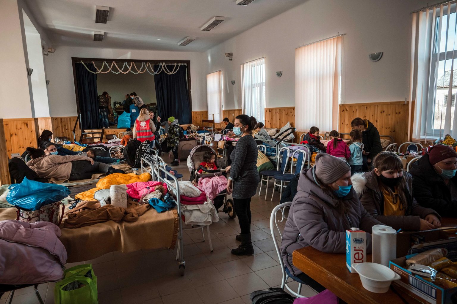 Ukraine refugee update showing displaced families receiving humanitarian aid in Ukraine during 2026