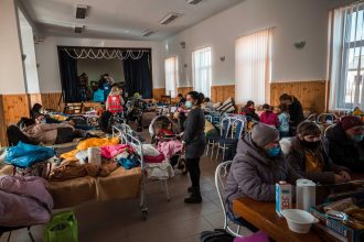 Ukraine refugee update showing displaced families receiving humanitarian aid in Ukraine during 2026