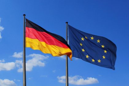 German and European Union flags representing Germany's concerns over EU protectionism and international trade.