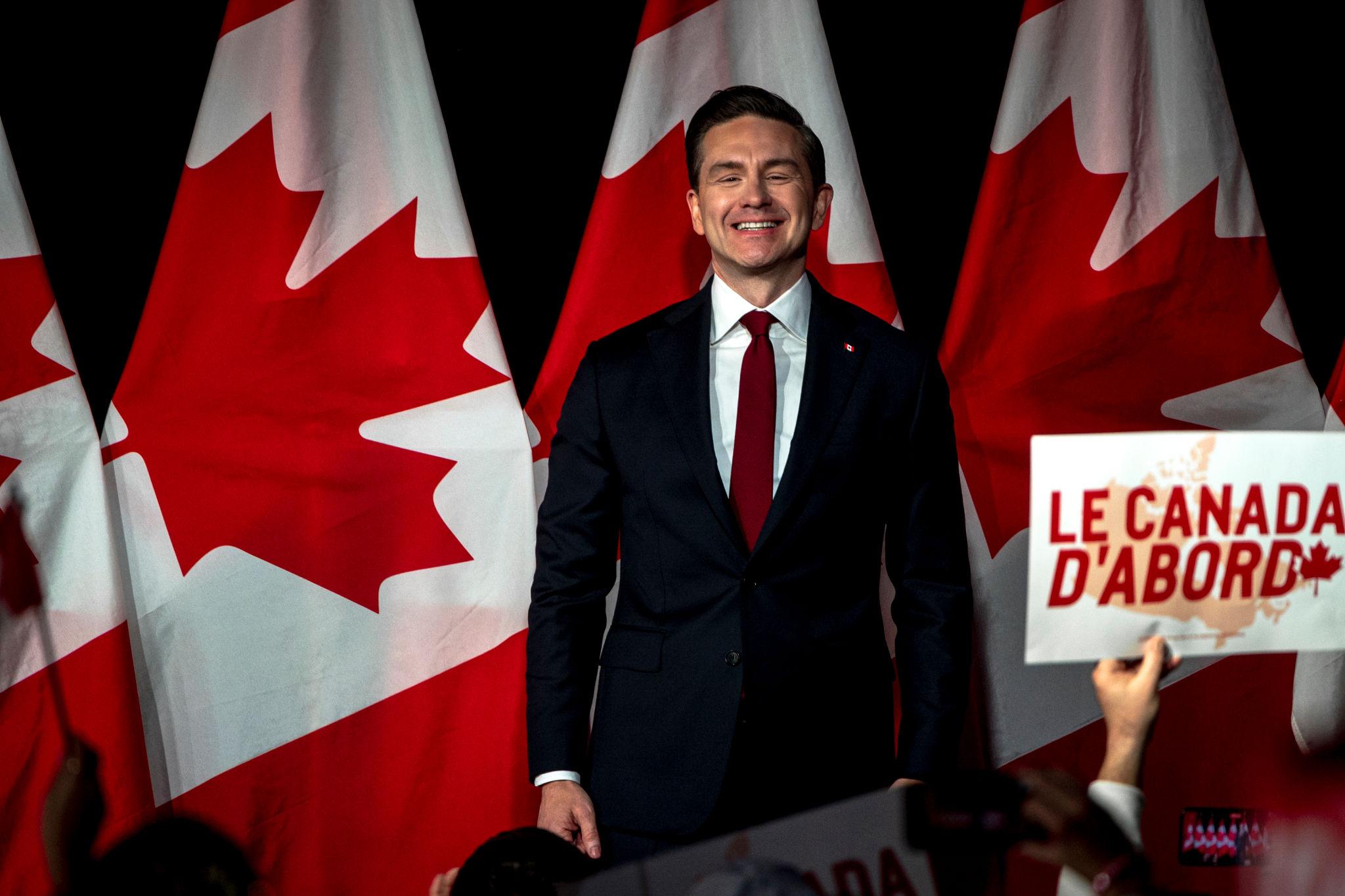 Canada opposition politics addressed by opposition lawmakers speaking to media