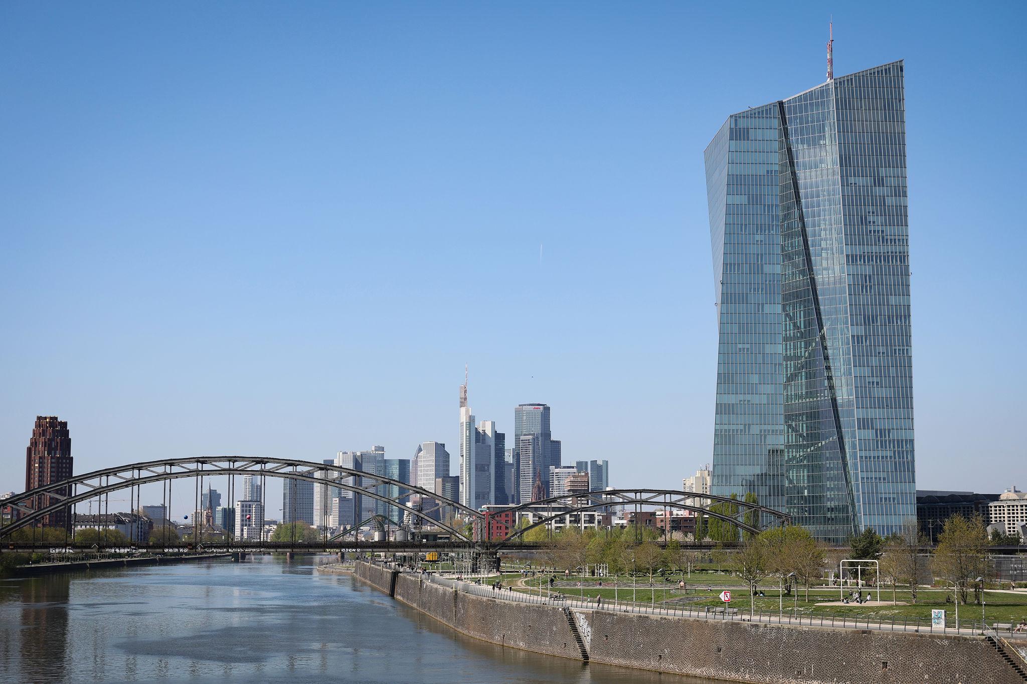 Euro currency trading screens following European Central Bank policy signals