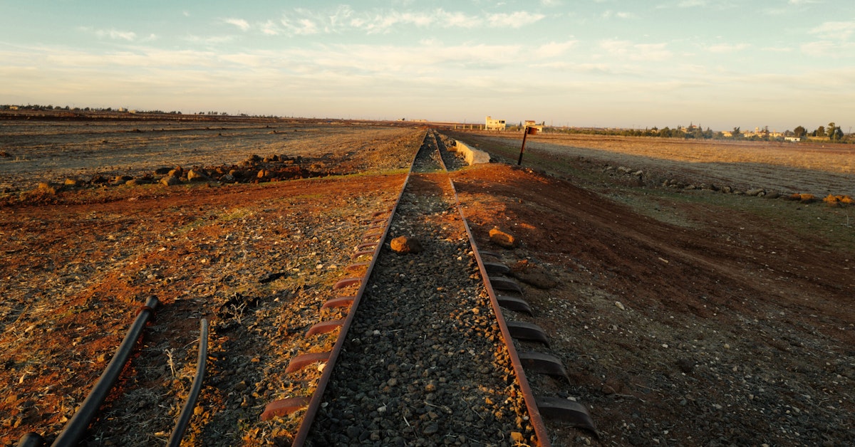 Iran railway shutdown at Mashhad station with halted trains and empty platforms