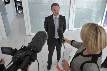 UK corporate reputation crisis management team discussing business communication strategy