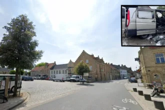 Lo-Reninge staff push the burning van away from the building