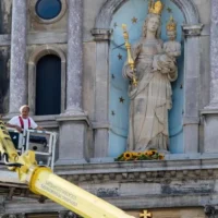 Madonna statue decorated with sunflowers for annual procession in Antwerp