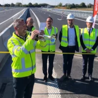 Mayor Vincent Van Quickenborne celebrates the new Kortrijk R8-A19 bridge