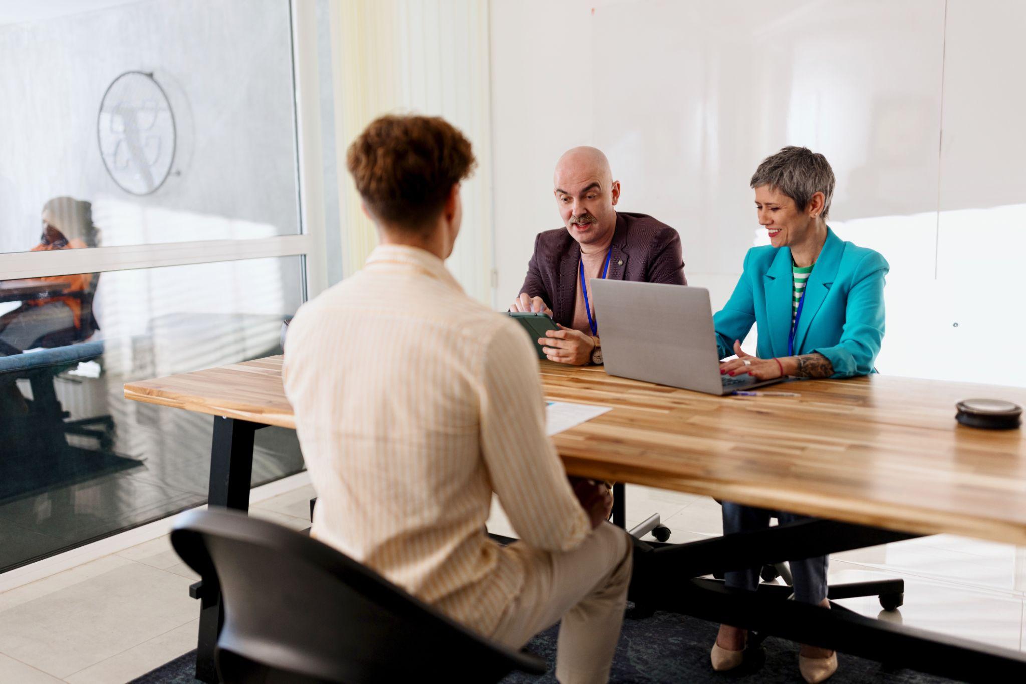 HR managers interviewing candidates as Business credibility attracts top talent