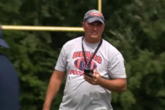 Missing Virginia football coach is wanted on child pornography and other charges, police say