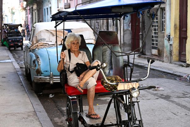 Elderly Cuban citizens discussing pension challenges amid economic pressures