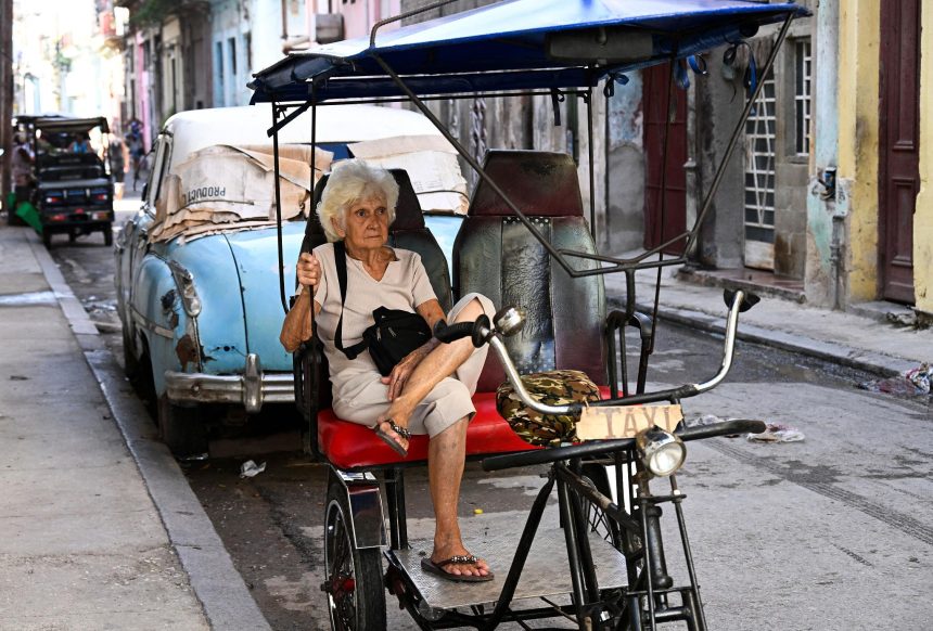 Elderly Cuban citizens discussing pension challenges amid economic pressures