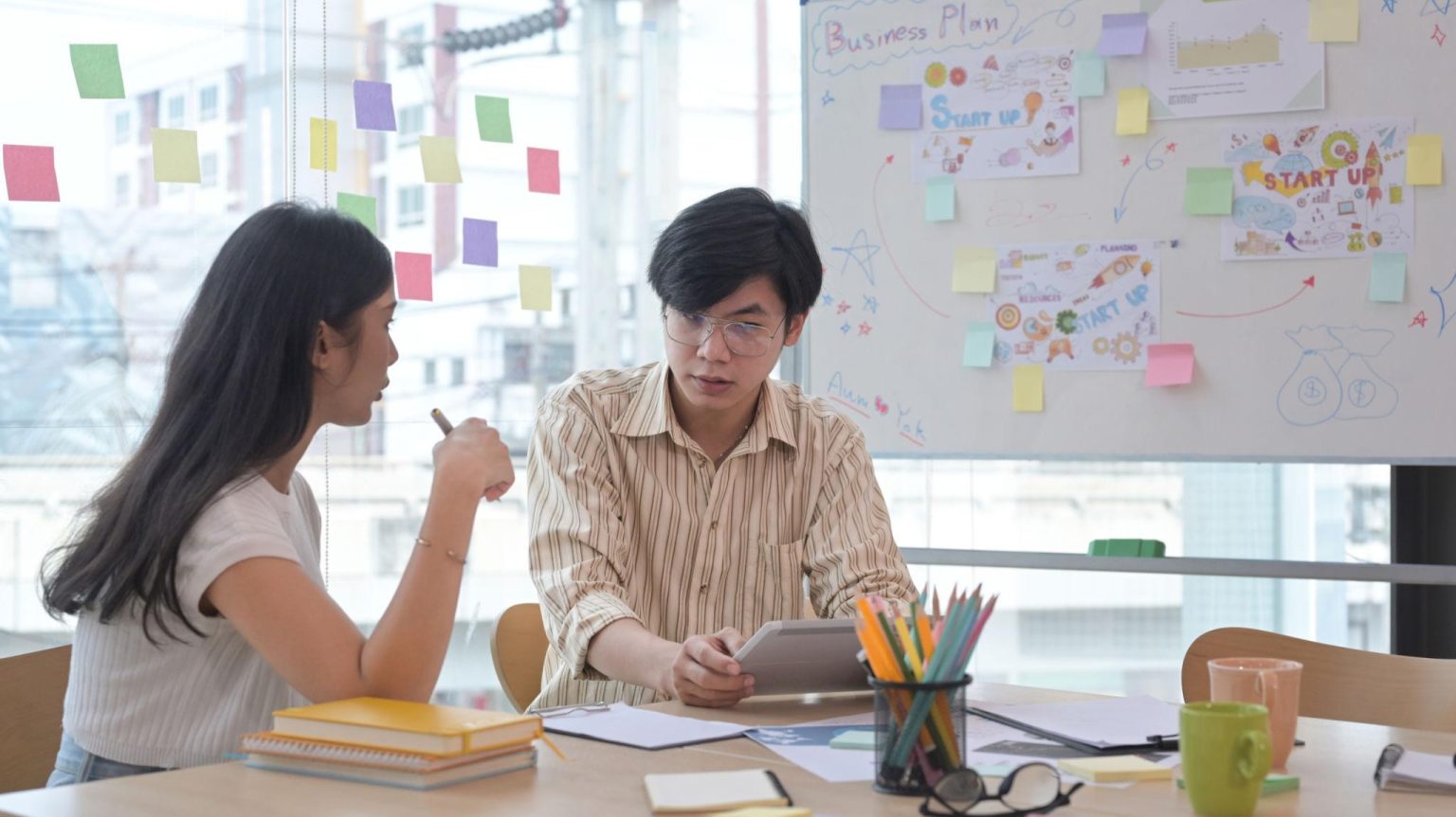 Entrepreneurs creating a business growth strategy before company registration