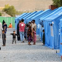 Rescue teams searching rubble during Iran humanitarian crisis response