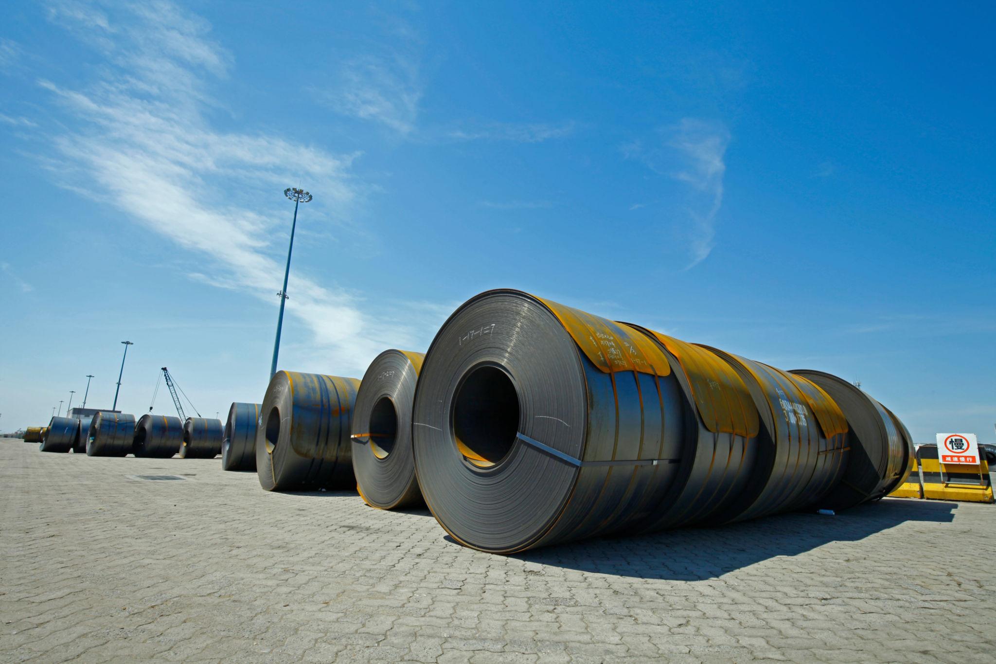 Cargo containers linked to China steel exports at an international shipping port
