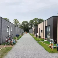 Oostakker's container village 391 Ukrainian refugees upported by Ghent's Mayor