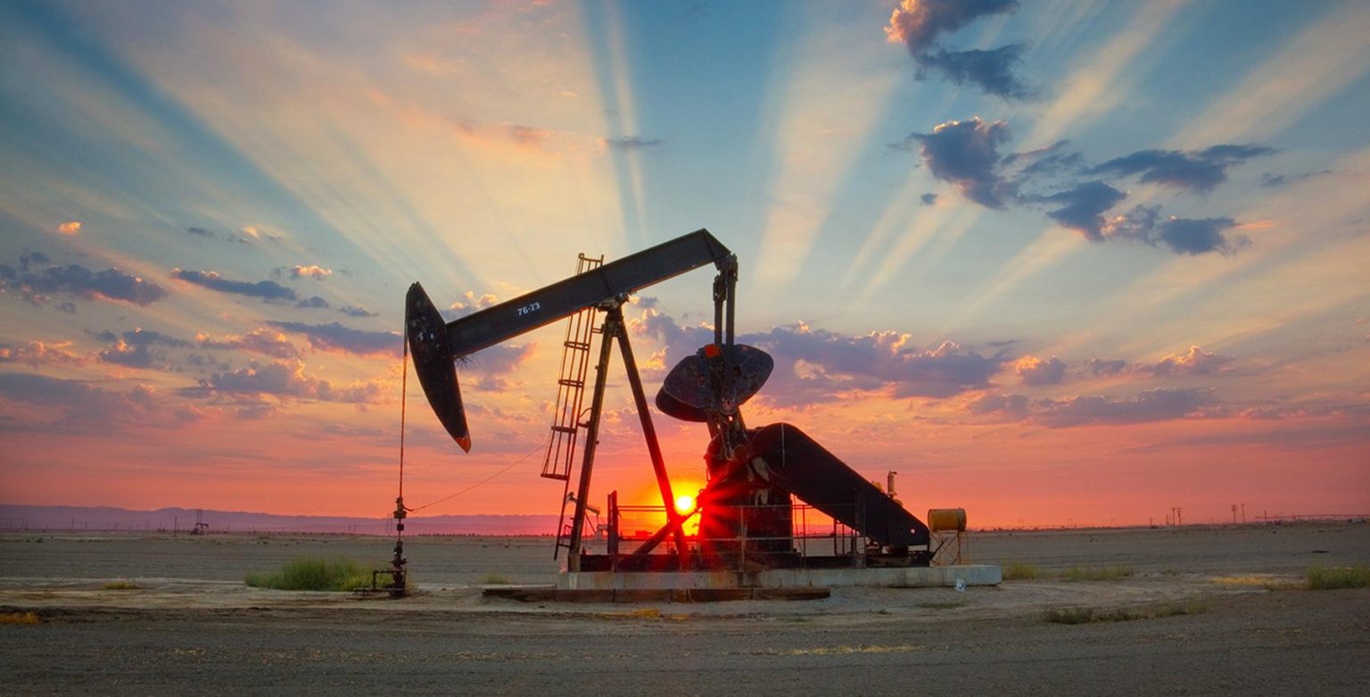 OPEC+ oil output represented by crude oil pumpjack at sunset