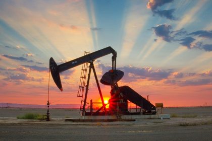 OPEC+ oil output represented by crude oil pumpjack at sunset