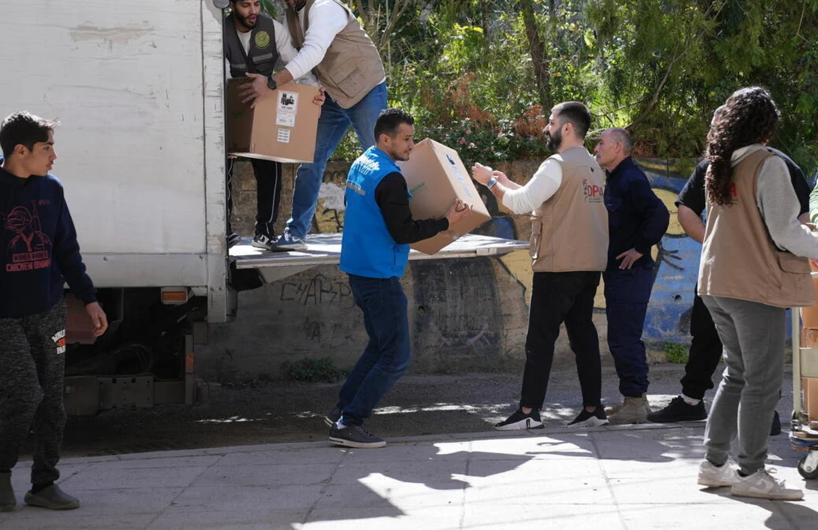 Aid workers providing relief during Israel Lebanon tensions humanitarian crisis
