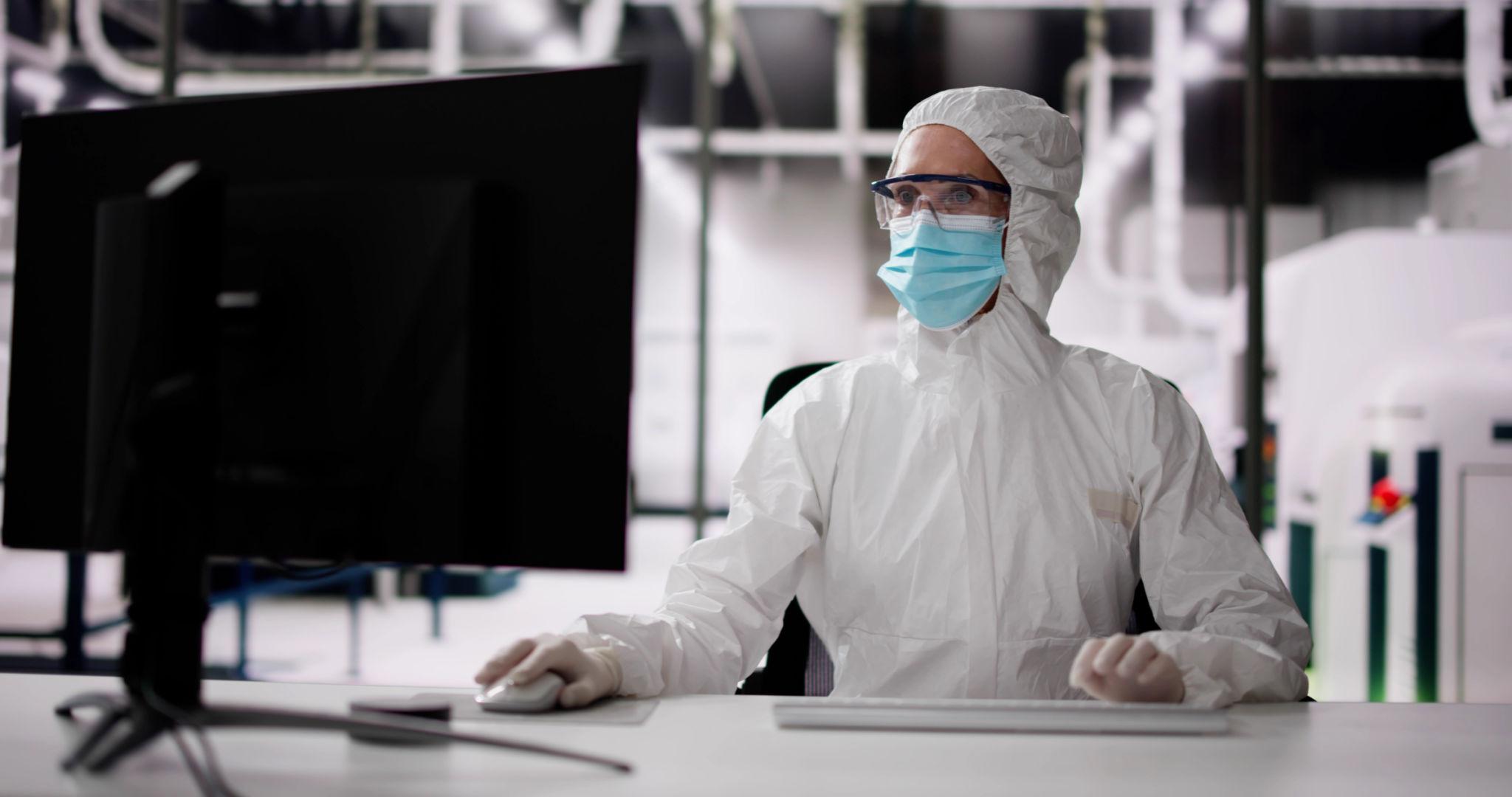 Engineers working in cleanroom amid AI semiconductor demand surge production expansion