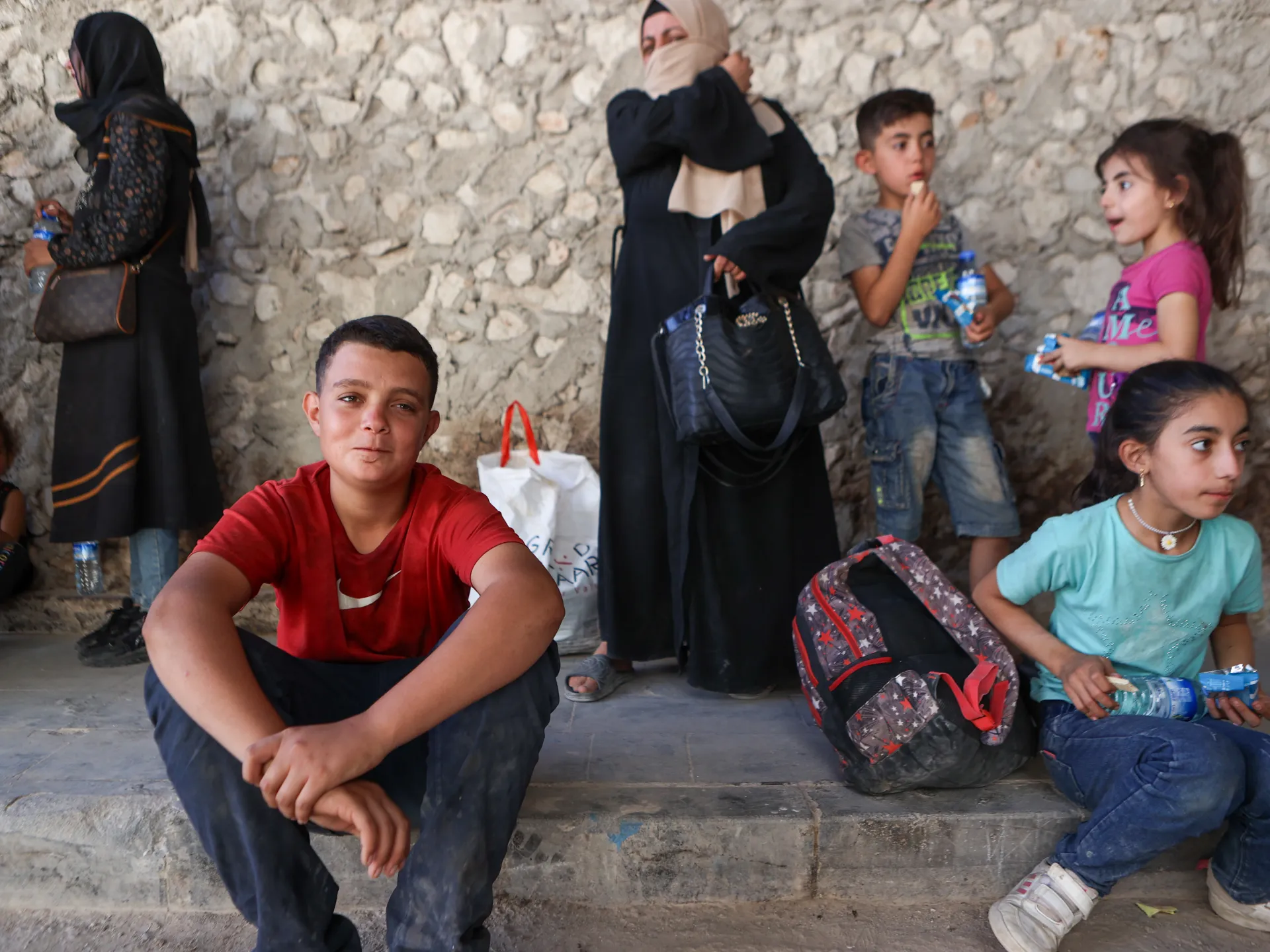 Syrian families pass checkpoints focused on civilian safety