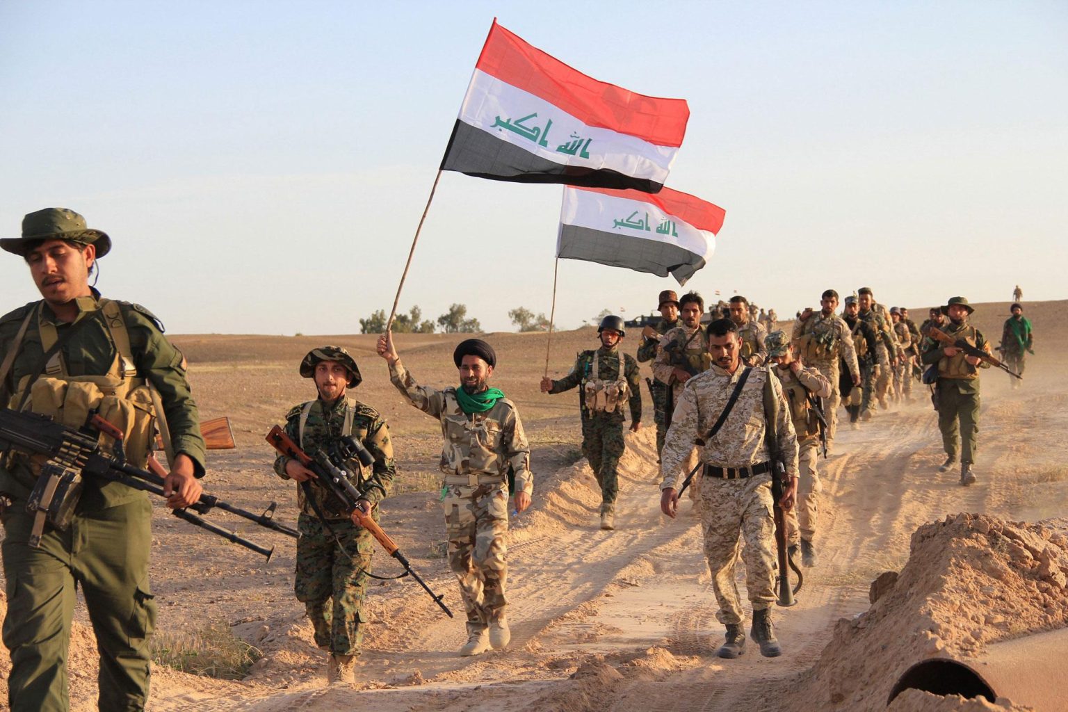 Iraqi security forces in Baghdad amid tensions over militia disarmament and the planned US withdrawal.