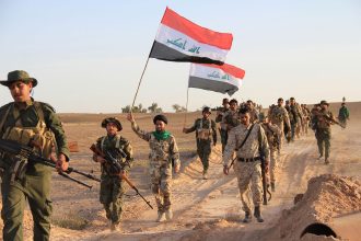 Iraqi security forces in Baghdad amid tensions over militia disarmament and the planned US withdrawal.