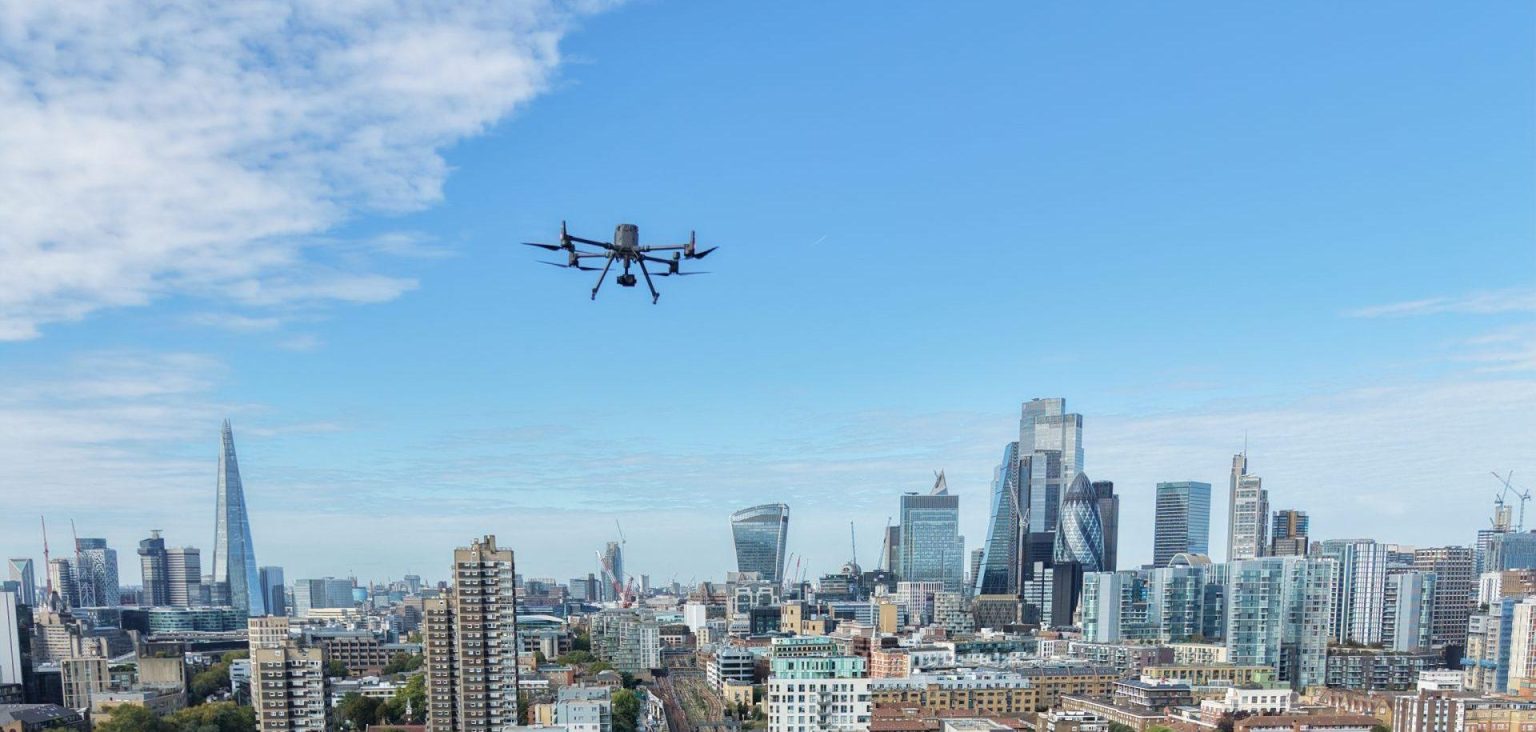 Commercial drone flying over European city as EU drone security rules evolve