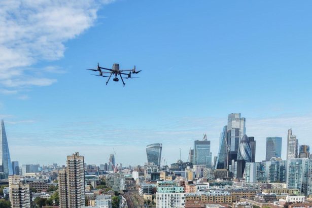 Commercial drone flying over European city as EU drone security rules evolve