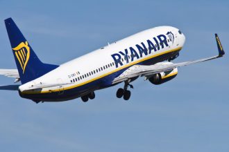 Ryanair Boeing 737 taking off from Brussels South Charleroi Airport amid Belgian route cuts.