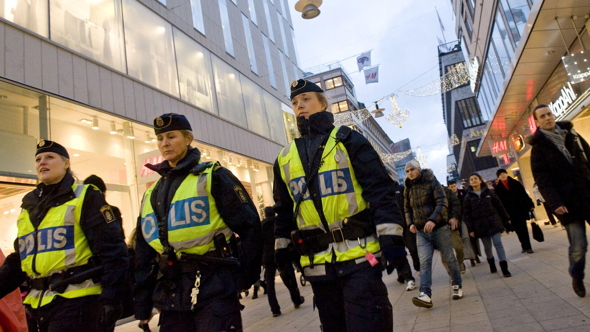 Sweden public safety with Swedish police officers monitoring security in Stockholm city center
