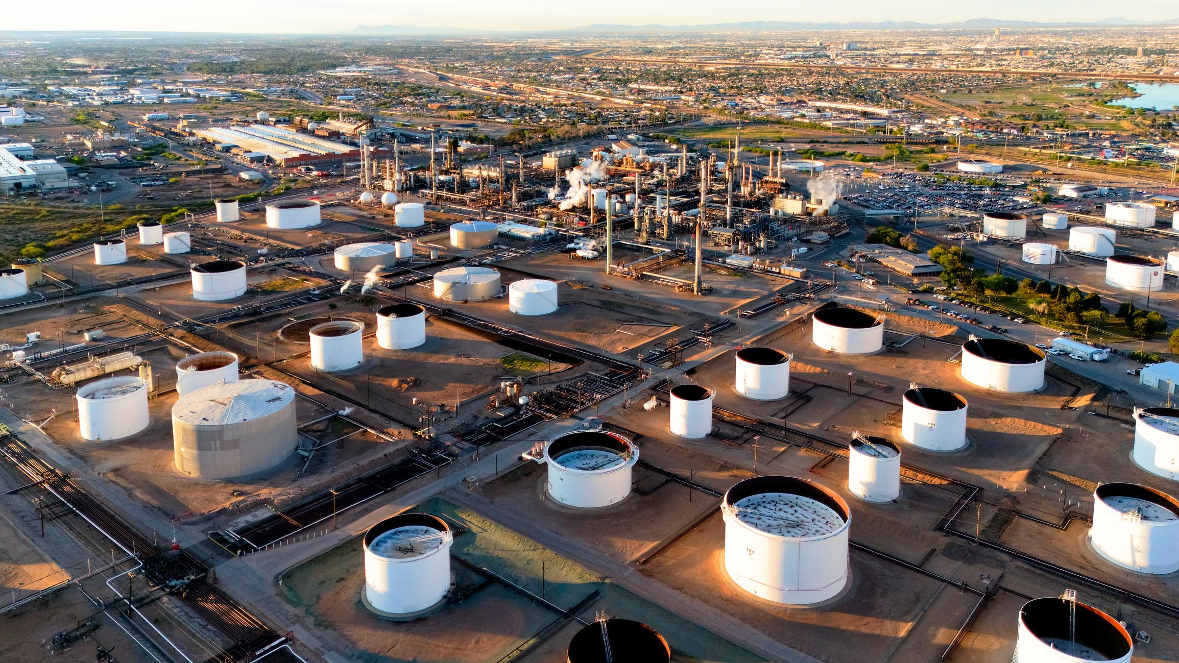 Crude oil storage tanks reflecting higher supply after the OPEC+ production decision