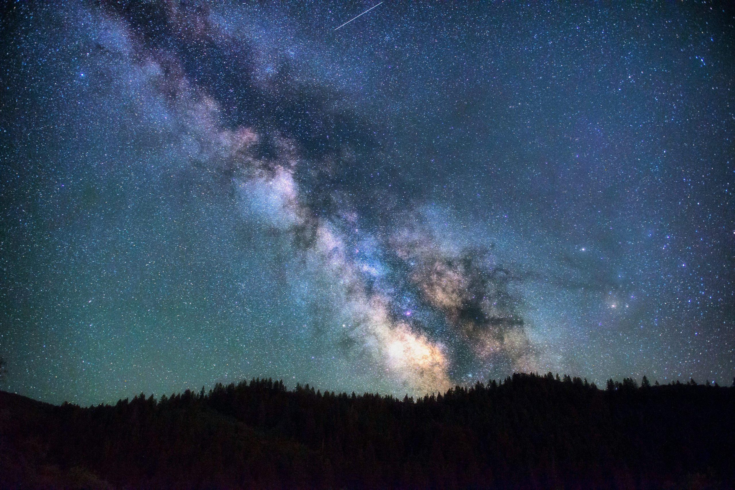 Milky Way galaxy collision with stars across deep space