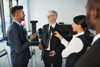 Public relations professionals conducting a media briefing as part of a crisis communication strategy for reputation management.