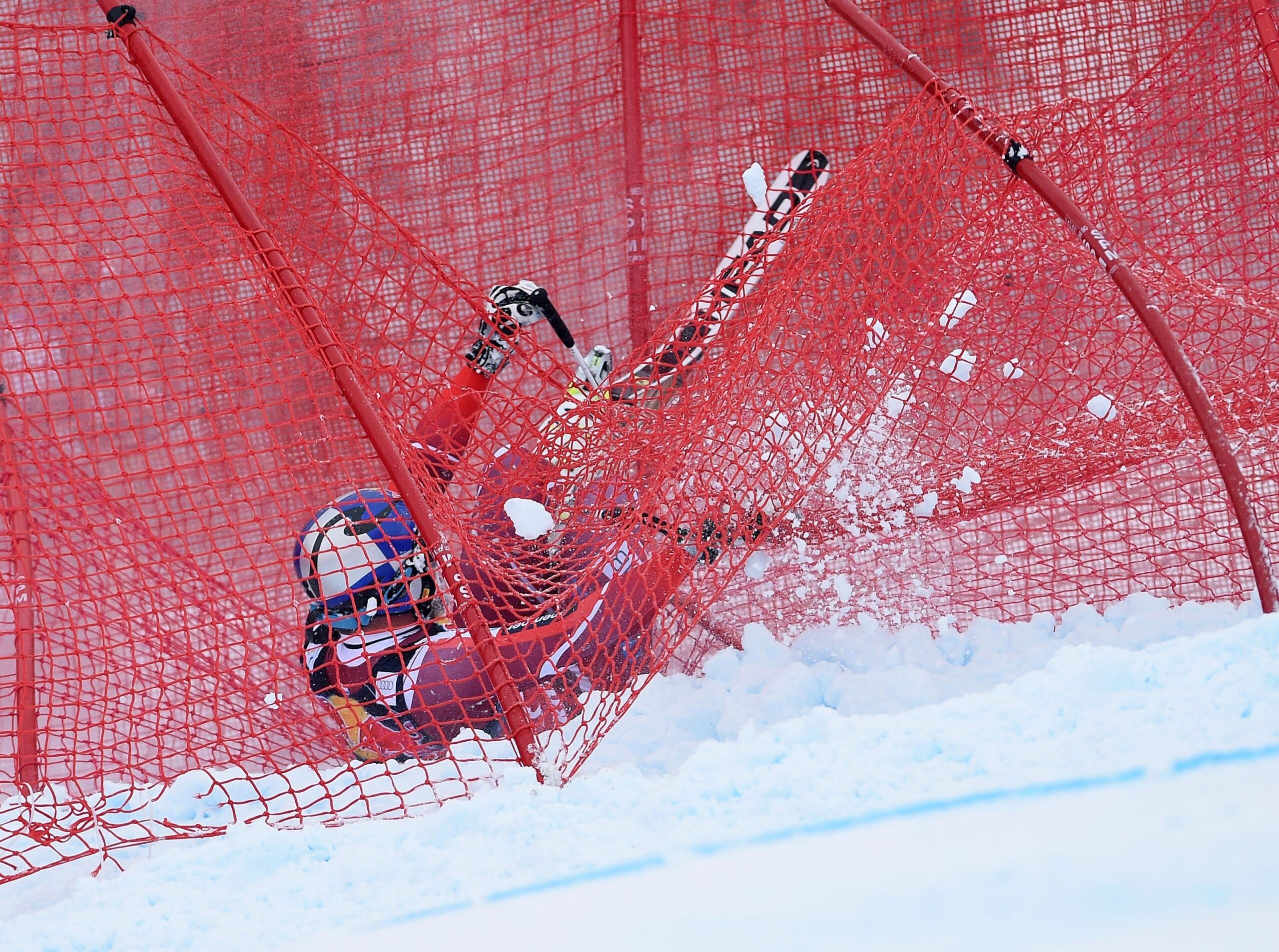 Ski racing crash stopped by safety nets on downhill course